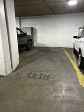 Garage floor 3 parking spot with room for storage locker/cabinet at the wall.