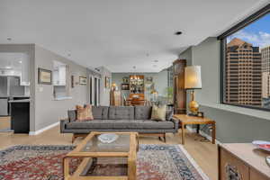 Open living and dining with peek through kitchen allows for views AND more cabinets