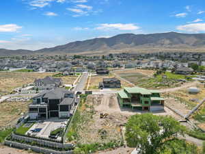Aerial view of residential area featuring a mountain backdrop
