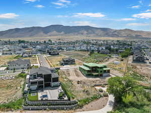 Aerial view of residential area featuring mountains