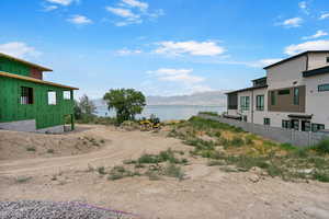 View of yard featuring a water and mountain view
