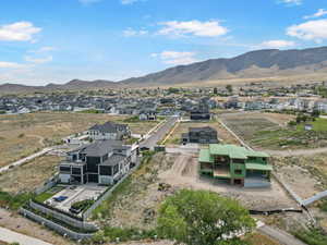 Aerial perspective of suburban area with a mountainous background