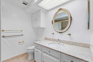 Bathroom with vanity and tile patterned flooring