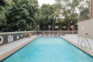 Community pool with a patio area