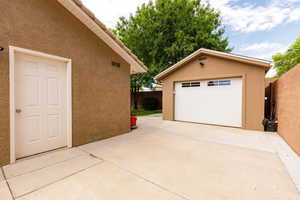 Detached garage with concrete driveway