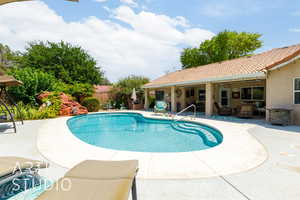 View of swimming pool featuring a patio