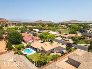 Aerial view of residential area featuring a mountain backdrop
