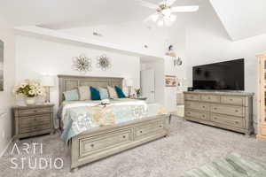 Carpeted bedroom featuring high vaulted ceiling, ensuite bathroom, and a ceiling fan