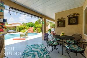 View of patio / terrace with an outdoor pool and outdoor dining space