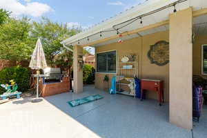 View of patio featuring exterior kitchen