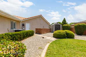 View of yard with a storage unit