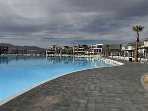 Community pool with a mountain view
