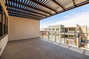 Balcony featuring a pergola and a residential view