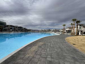 Community pool with a residential view