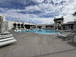Community pool with a patio area