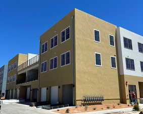 View of building exterior featuring a garage