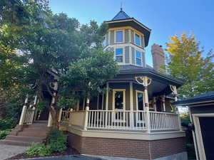 Victorian house with covered porch and a chimney