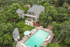 View of subject property featuring a pool