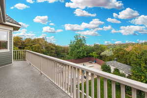 Balcony with view of scattered trees