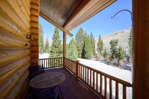 Wooden deck featuring a forest view