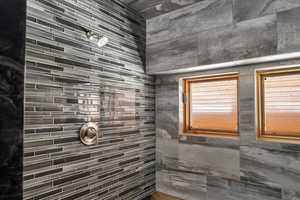 Full bathroom featuring tiled shower