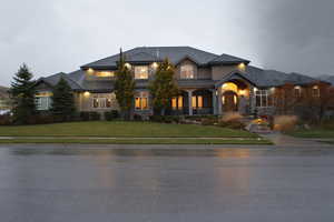 View of front of house with a front lawn and covered porch