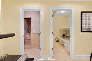 Hall featuring baseboards