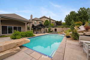 View of swimming pool with a gazebo, a patio, and a fenced backyard