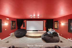 Cinema featuring rail lighting and carpet