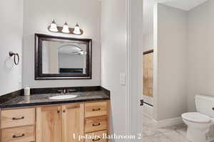 Bathroom featuring vanity and  shower combination