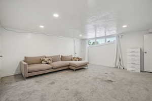 Living area featuring recessed lighting and carpet flooring
