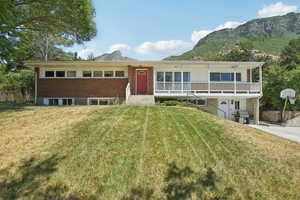 View of front of home featuring a mountain view and brick siding