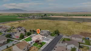 Aerial view of property's location featuring rural landscape and nearby suburban area
