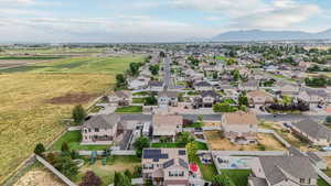 Aerial perspective of suburban area with a mountainous background