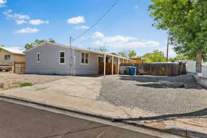 Manufactured / mobile home featuring driveway and a carport