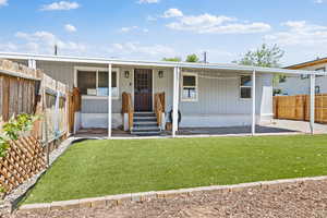 View of front of home with a fenced backyard