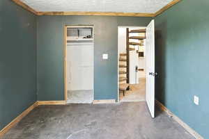 Unfurnished bedroom with carpet floors and a closet