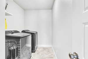 Laundry room with separate washer and dryer