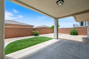 Fenced backyard featuring a patio
