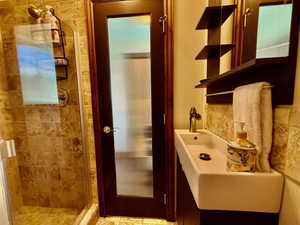 Bathroom featuring a shower stall