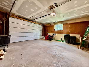 Garage featuring a garage door opener
