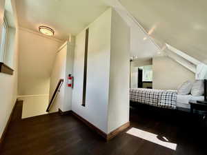 Staircase featuring wood finished floors and recessed lighting