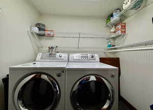 Washroom featuring independent washer and dryer