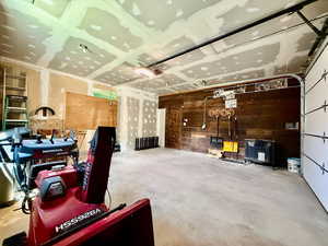 Garage featuring wooden walls
