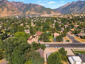 Aerial view of property's location with a mountain backdrop