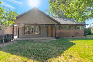 View of front of property featuring brick siding and a shingled roof