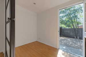 Empty room with wood finished floors and baseboards