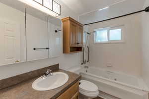 Full bathroom featuring shower / tub combination and vanity
