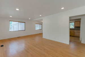 Unfurnished room featuring light wood-type flooring and recessed lighting
