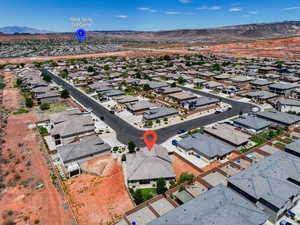 Aerial perspective of suburban area featuring a mountainous background